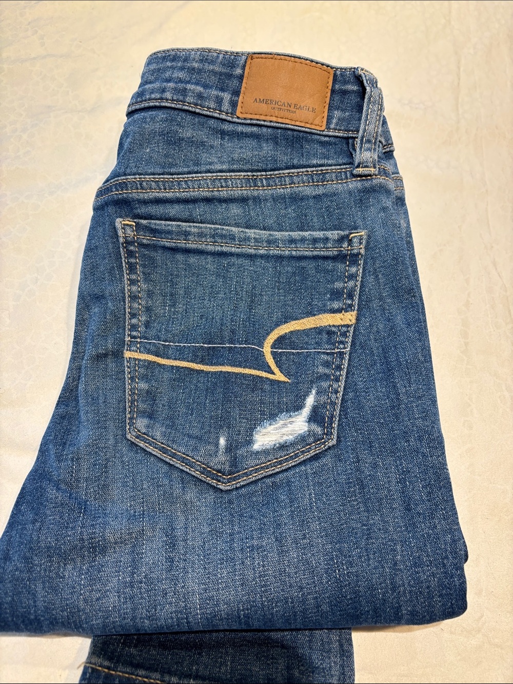 American Eagle Outfitters SuperWomen's Medium Blue Skinny Jeans with Tan Patch